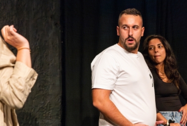 improvisers performing on stage