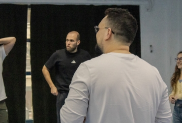 people in a workshop working on an improv format show